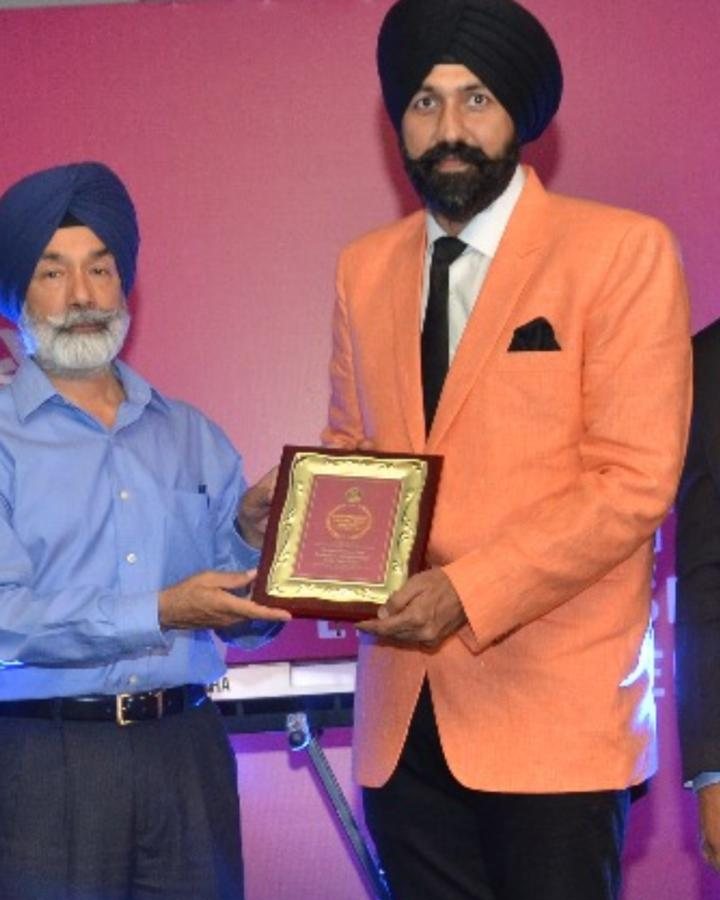 Ravinder Singh ji, honoured on stage